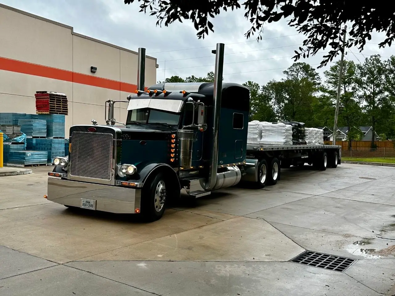 Francisco’s actual truck and flatbed trailer from his former trucking business